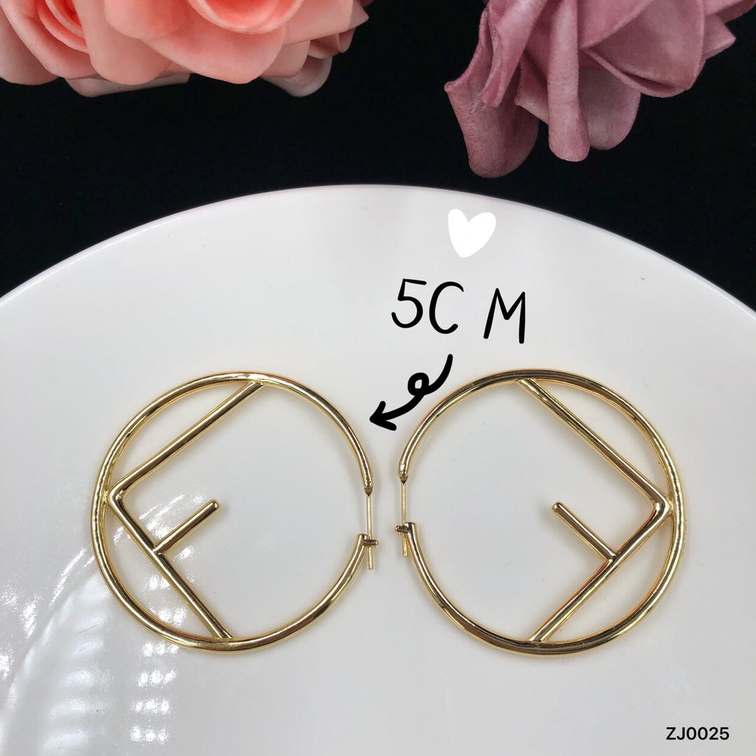 F gold earrings